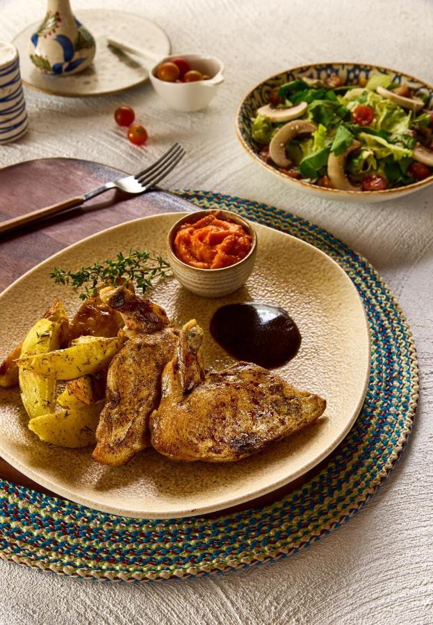 Benben By Dhara Hotels - Adults Only Асуан Экстерьер фото A plate of chicken and potatoes